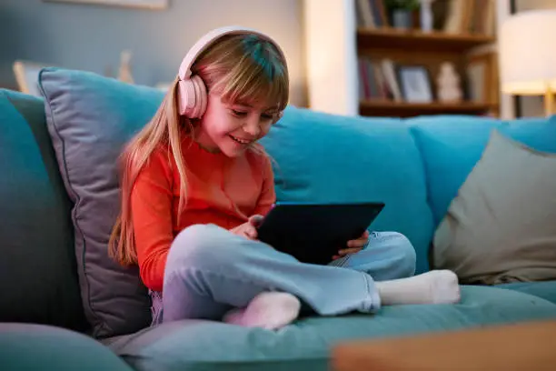 Children learning Greek on a tablet